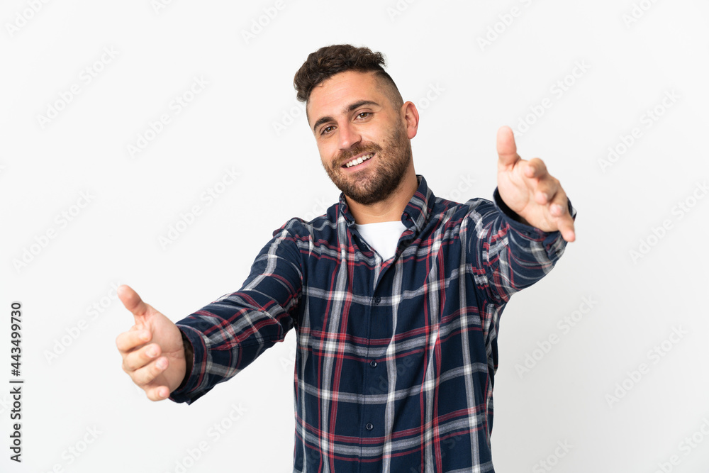Caucasian man isolated on white background presenting and inviting to come with hand Caucasian man isolated on white background presenting and inviting to come with hand