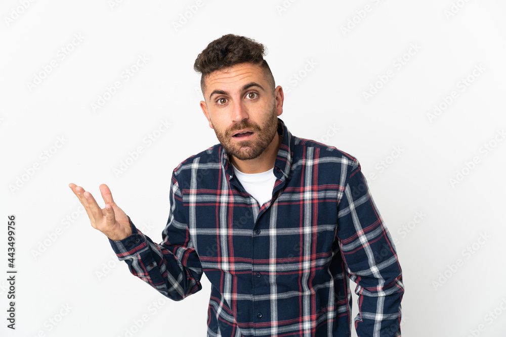 Caucasian man isolated on white background making doubts gesture Caucasian man isolated on white background making doubts gesture