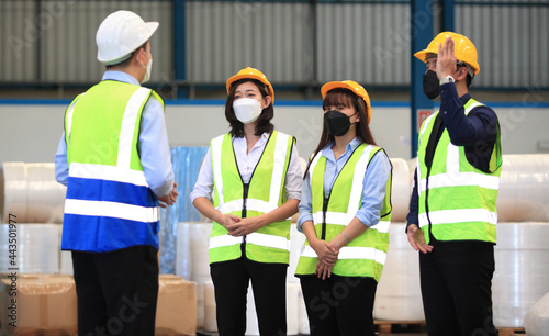Team workers wear protective face masks for safety industrial factory. worker meeting before start working in factory or warehouse © sittinan