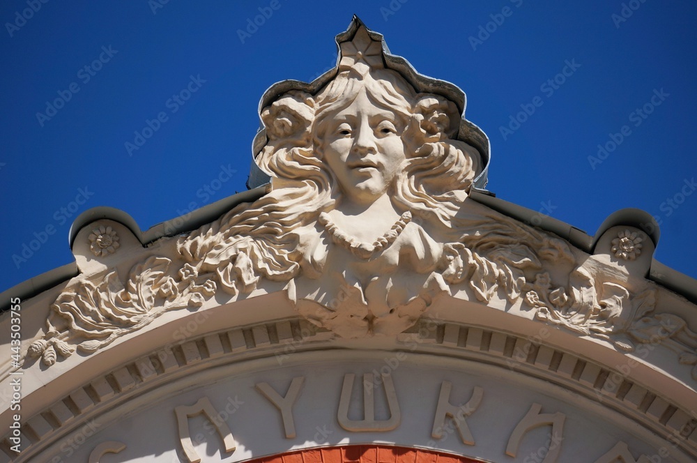 Russia. Pskov region. Pskov. Bas-relief of a woman's face on the building of the Pskov Academic Drama Theater named after A.S. Pushkin