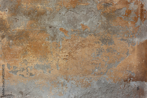 old concrete wall with bronze paint stains