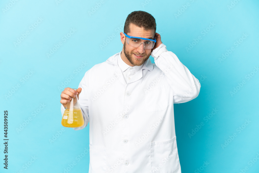 Young caucasian scientific man isolated on blue background having doubts Young caucasian scientific man isolated on blue background having doubts