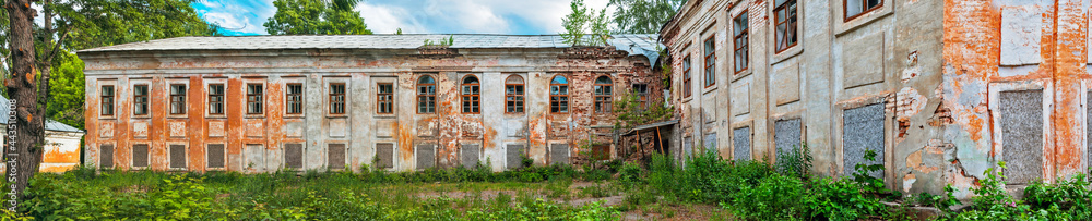 old ruined building in an abandoned park on a summer day