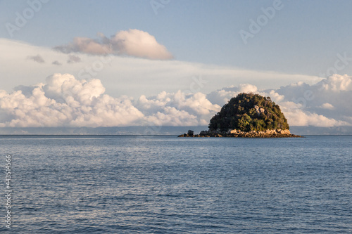 sunset over Ngaio Island in Abel Tasman National Park, South Island, New Zealand photo