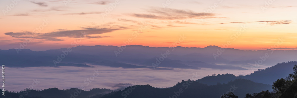 View of foggy morning sky above misty forest. winter season in Thailand. Panorama, Panoramic Shot.