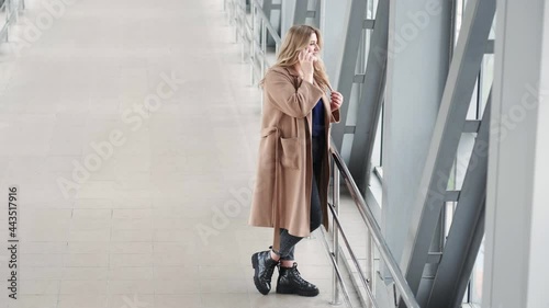 Wallpaper Mural Urban phone call. Mobile communication. Successful female. Body positive. Confident overweight obese chubby woman using gadget on light bridge empty space background. Torontodigital.ca