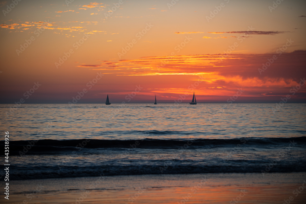 Sunrise over the sea and beautiful cloudscape. Colorful ocean beach sunset. Sunrise over the sea and beautiful cloudscape. Colorful ocean beach sunset.