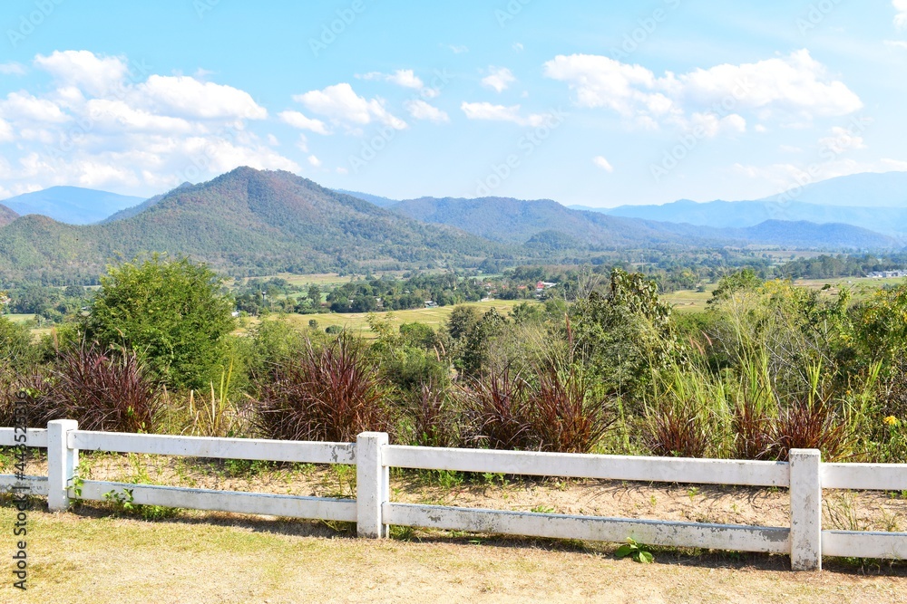 Scenic view of mountains and white fence in Mae Hong Son, THAILAND.