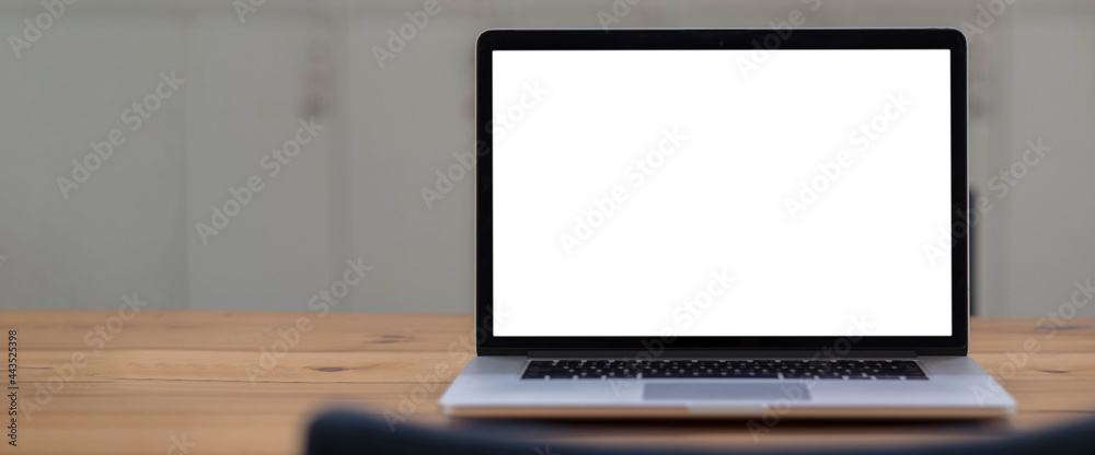 Fototapeta premium Blank screen Laptop computer and poster workspace background in modern office