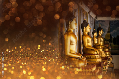 Buddha image with gold background.