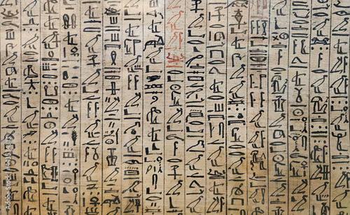 The writing of the ancient Egyptians. Ancient Egyptian hieroglyphs and images of people on papyrus.