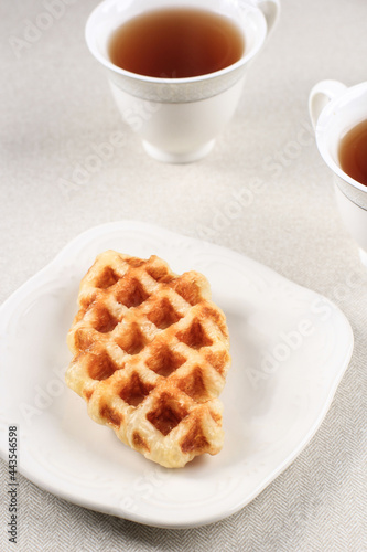 Plain Croffle Croissant Waffle on White Palte. This Snack Popular in South Korea