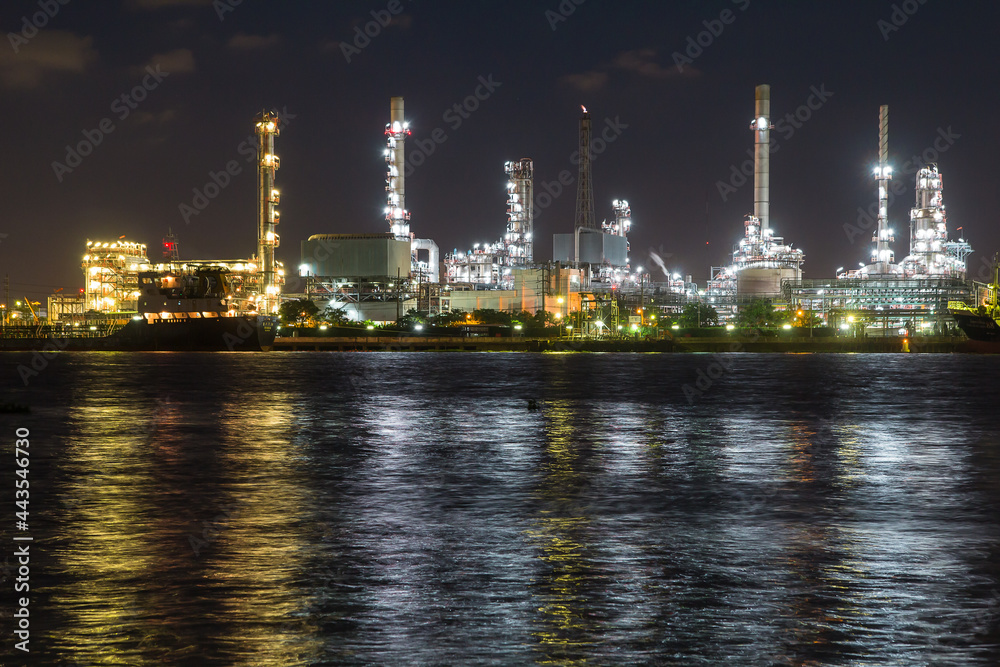 Oil refinery on water front  at night