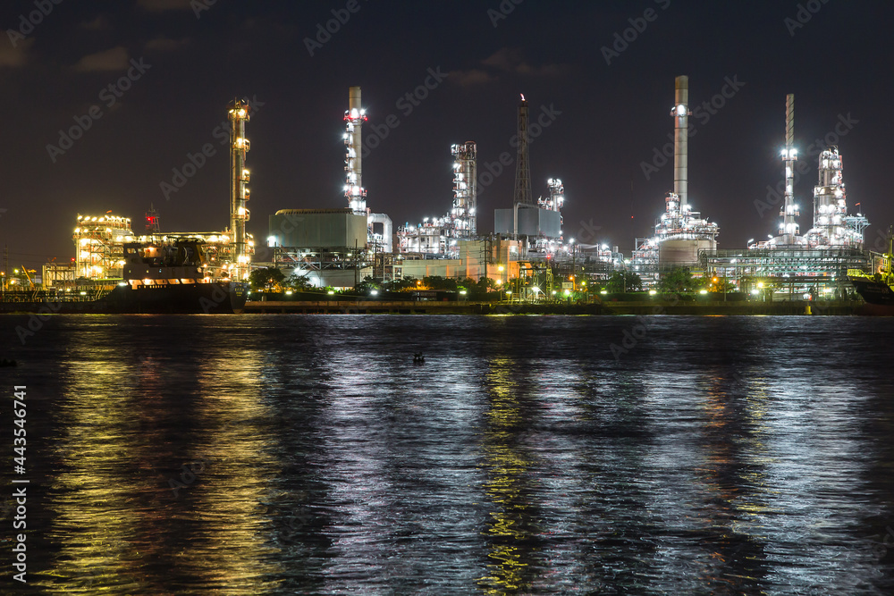 Oil refinery on water front  at night