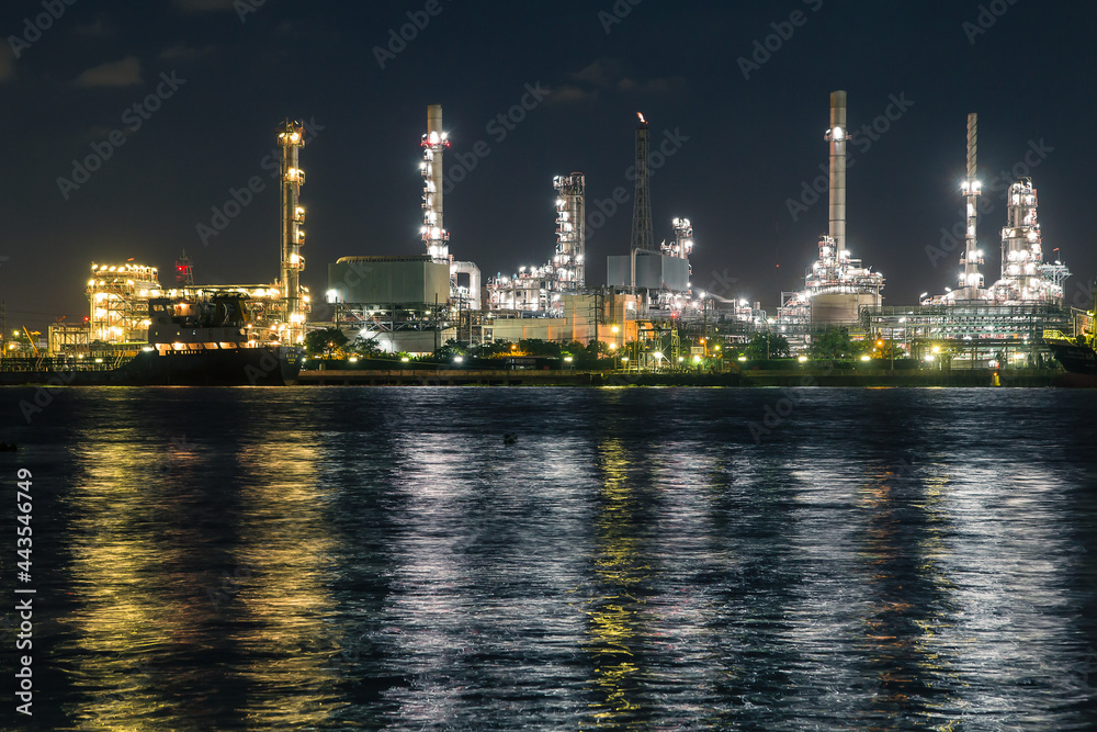 Oil refinery on water front  at night