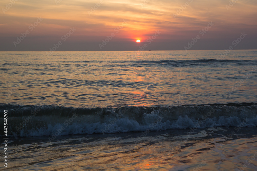 Morning sunrise light shining on ocean wave