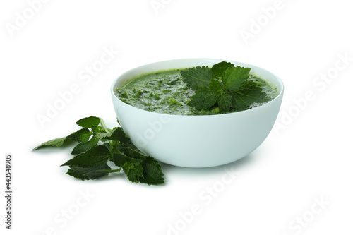 Plate of nettle soup isolated on white background