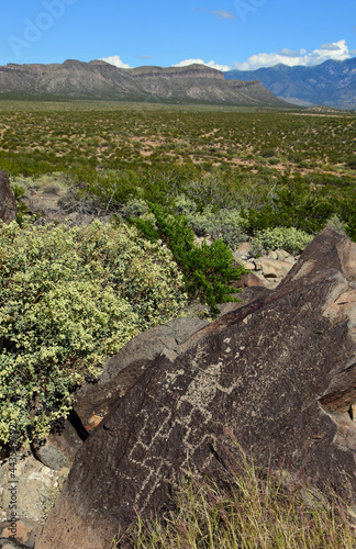 the ancient native american petroglyphs on a sunny fall day at three rivers petroglyph site, near tularosa, new mexico photo