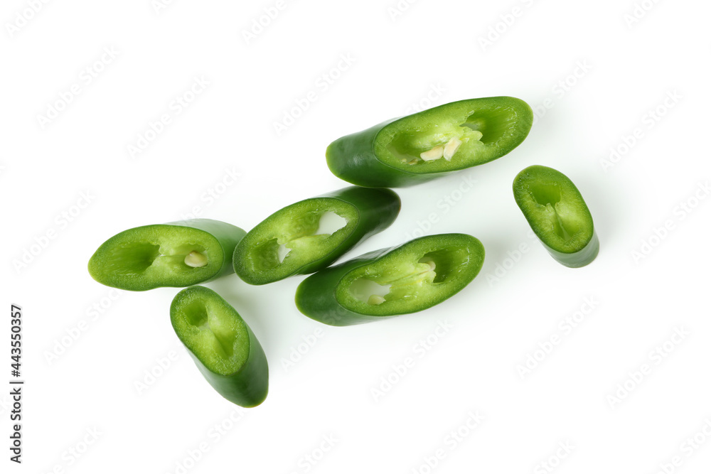 Green hot chili pepper slices isolated on white background Green hot chili pepper slices isolated on white background