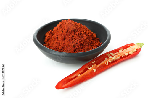 Red hot chili pepper powder and half isolated on white background