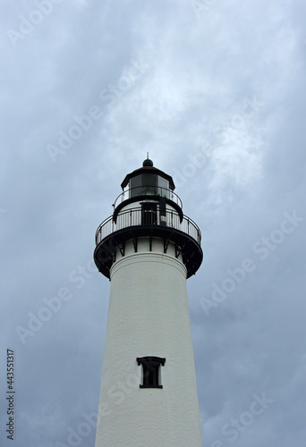 the top of picturesque st. simons lighthouse on a stormy day on st. simons island in southern georgia