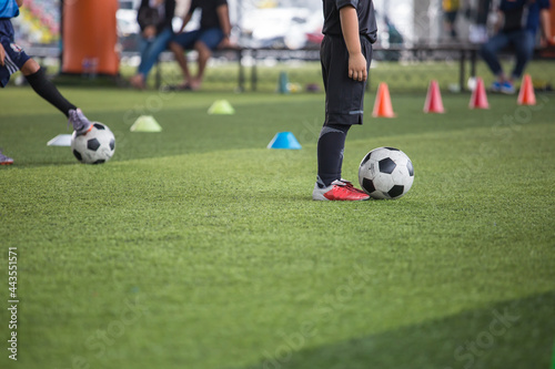  Boys Soccer ball tactics on grass field with cone