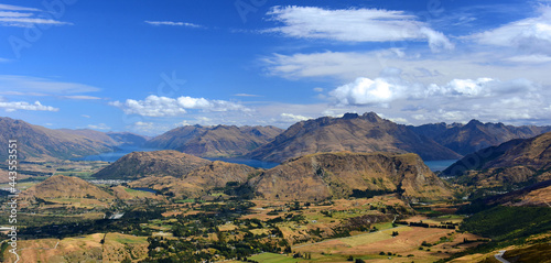 spectacular view across speargrass flat and dalefield to lake wakatipu and mountain peaks, from coronet peak. near queenstown on the south island of new zealand