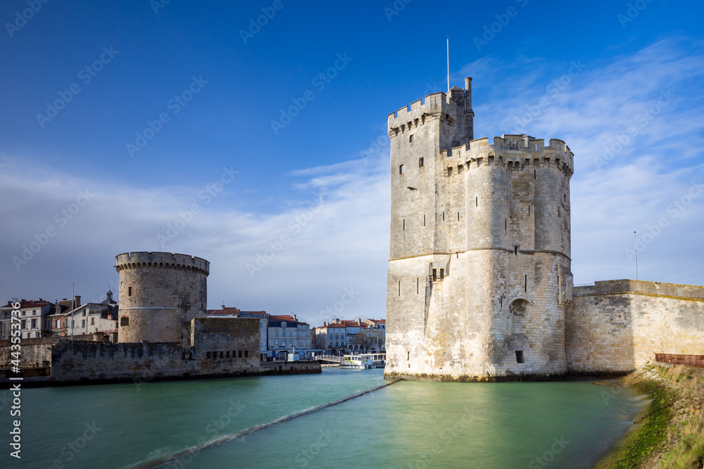 Entrance of the old harbor of La Rochelle in France, with the Tour de la Chaine on the left  and the Tour Saint-Nicolas on the right, Nouvelle Aquitaine region, department of Charente-Maritime, France