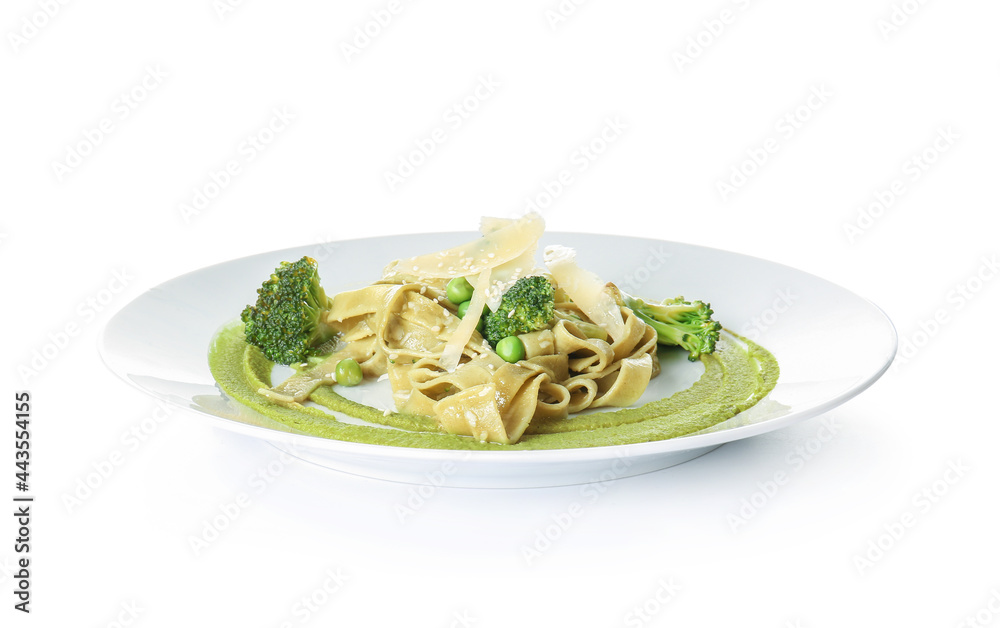 Plate with tasty pasta and vegetables on white background