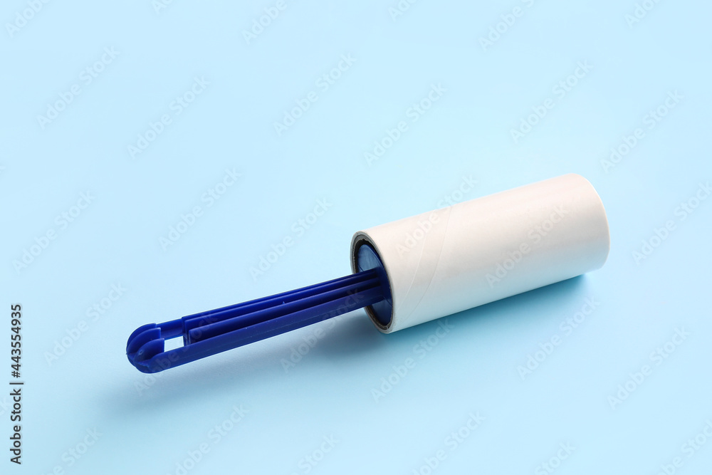 Lint roller on color background Lint roller on color background