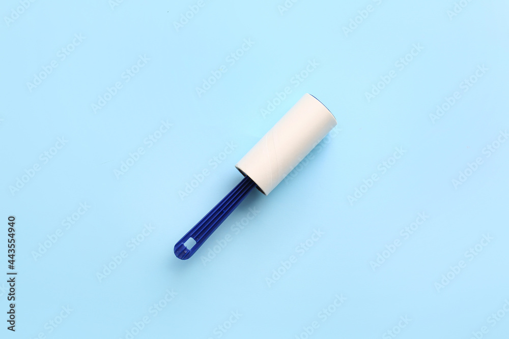 Lint roller on color background Lint roller on color background