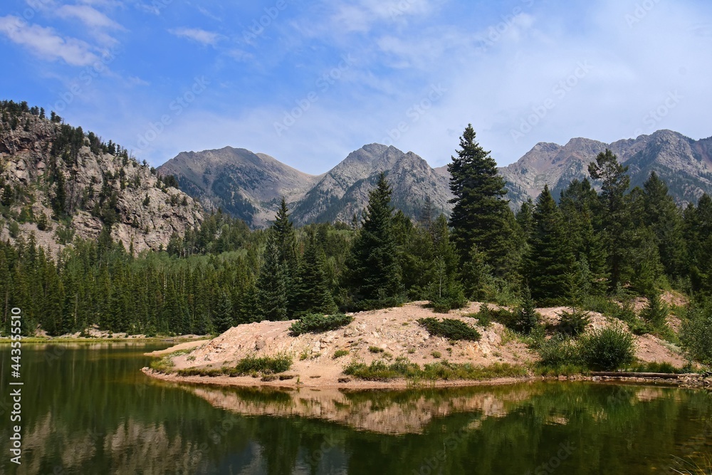 panoramic view of potato lake and the west needle mountains on  a sunny day in summer in the san juan national forest near durango, colorado