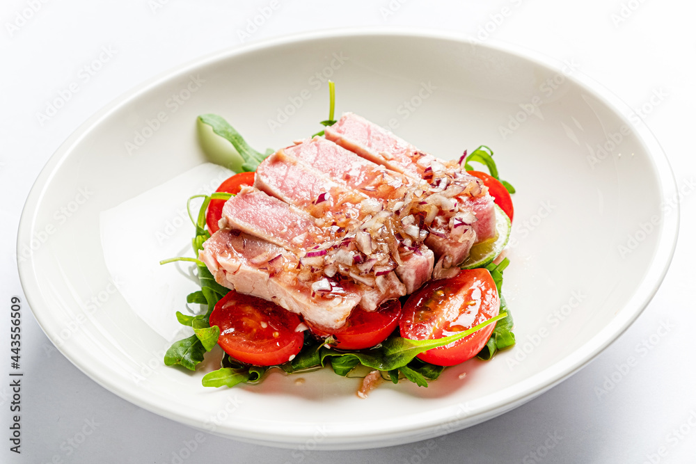 tuna fillet with salad on white plate tuna fillet with salad on white plate