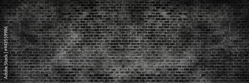 Panorama old black brick texture detail background. Paint brickwork wall and copy space.
