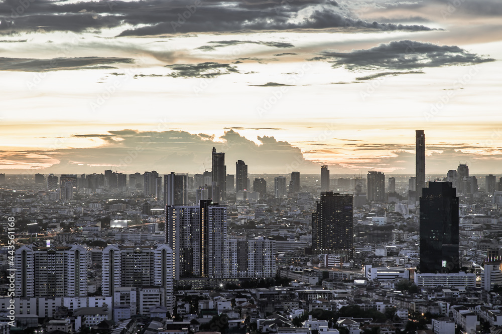 Bangkok, thailand - Jul  02, 2021 : Aerial view of Beautiful sunset over large metropol city in Asia. With tall building and skyscraper in background. Monotone, Selective focus.