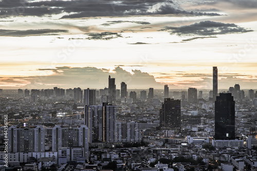 Bangkok, thailand - Jul 02, 2021 : Aerial view of Beautiful sunset over large metropol city in Asia. With tall building and skyscraper in background. Monotone, Selective focus.