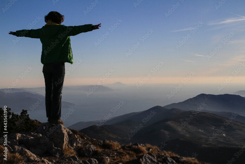Carefree woman with arms outstretched on mountaintop, Kvarner, Croatia
Carefree woman with arms outstretched on mountaintop, Kvarner, Croatia