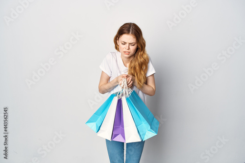 woman with multicolored packs of emotions shopping Shopaholic lifestyle © SHOTPRIME STUDIO