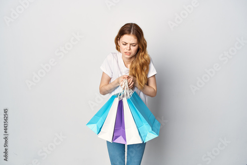 woman with multicolored packs of emotions shopping Shopaholic lifestyle