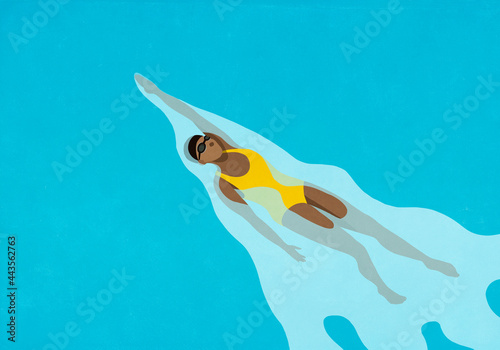 Woman swimming backstroke in water
 photo