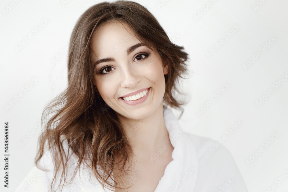 The beautiful girl is having a photo session in the studio in a night dress. The beautiful girl is having a photo session in the studio in a night dress.