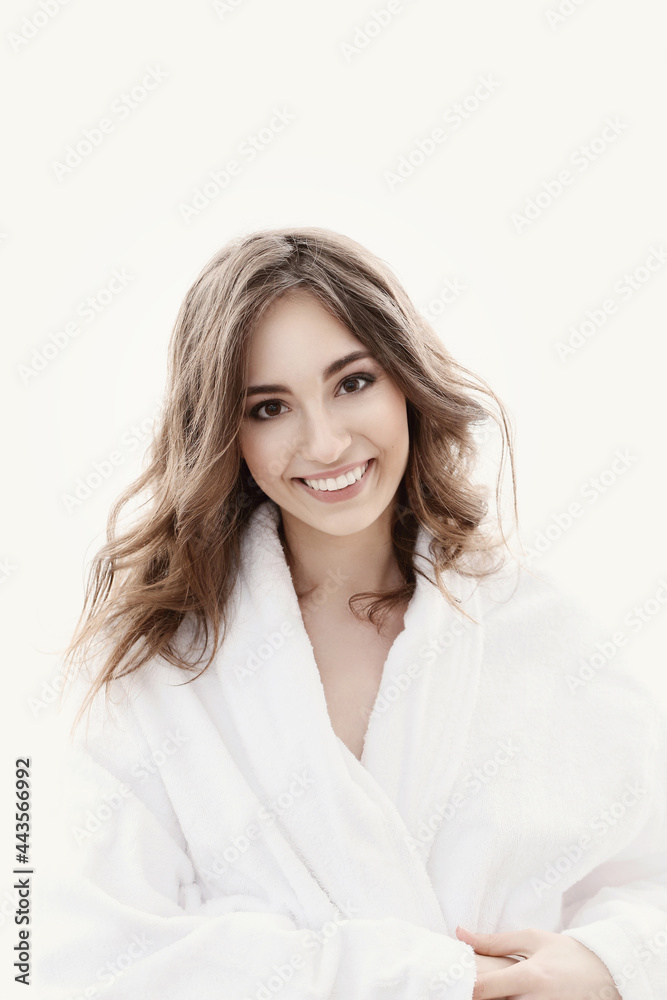 The beautiful girl is having a photo session in the studio in a night dress. The beautiful girl is having a photo session in the studio in a night dress.