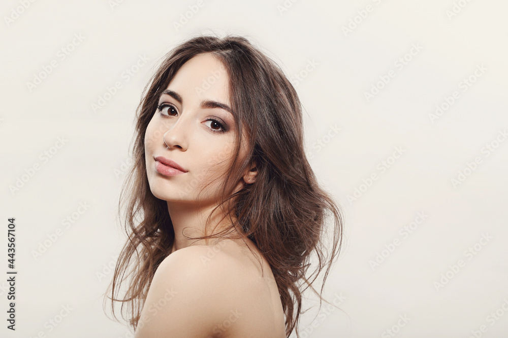 The beautiful girl is having a photo session in the studio in a night dress. The beautiful girl is having a photo session in the studio in a night dress.