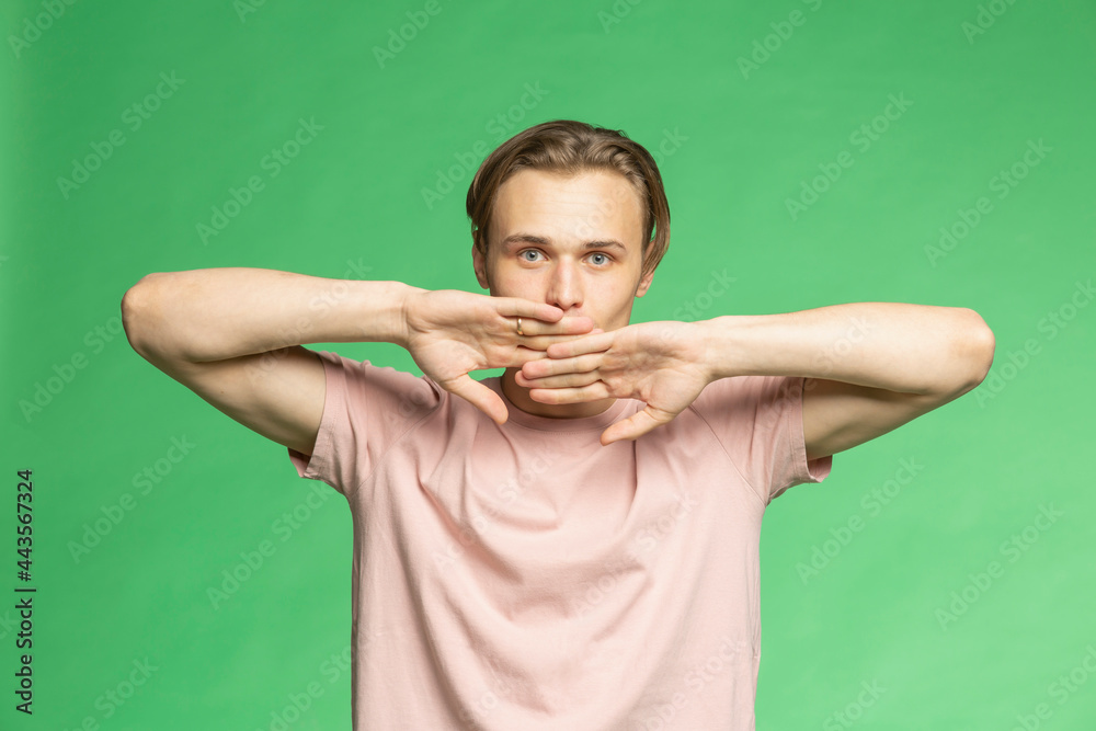 Studio portrait young man with hands covering face
Studio portrait young man with hands covering face