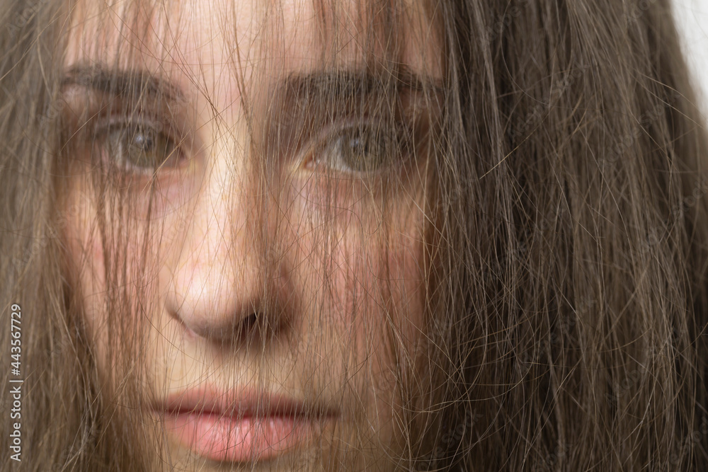 Close up portrait hair in face of beautiful young brunette woman
Close up portrait hair in face of beautiful young brunette woman