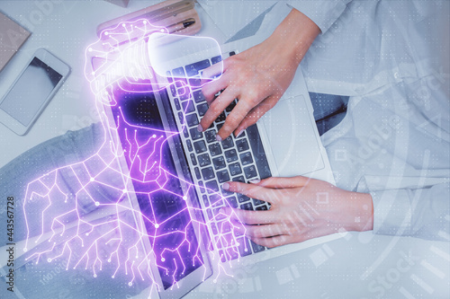 Double exposure of woman hands working on computer and man in ar glasses hologram drawing. Top View. Virtual reality concept.