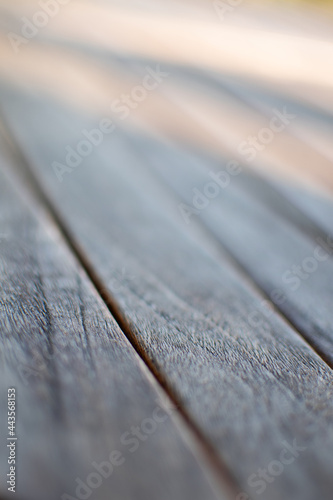 Close up of wooden plank floor. Selective focus blurred areas. Vertical photo.