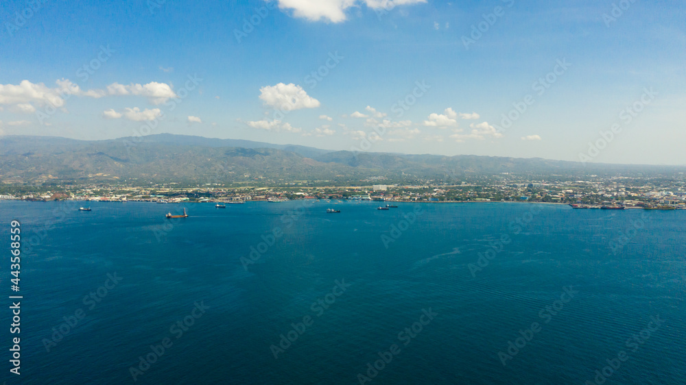 Aerial drone of Zamboanga city with its seaport and ships. Commercial and industrial center of the Zamboanga Peninsula Region. Mindanao, Philippines.