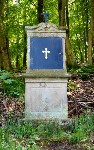 Stone Christ Cross on Forest Walk Path  photo