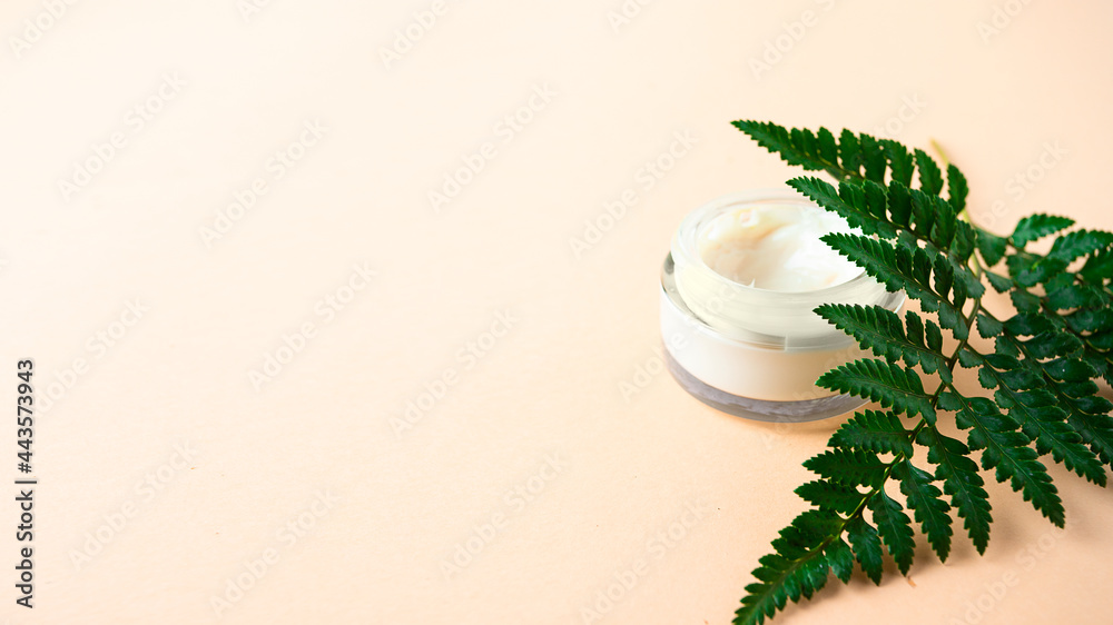 Herbal cosmetic cream in crystal jar natural with green leaf for natural skin care concept. Herbal cosmetic cream in crystal jar natural with green leaf for natural skin care concept.